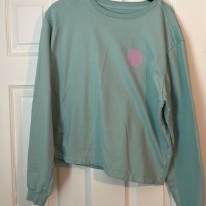 Light blue and pink crop sweatshirt.